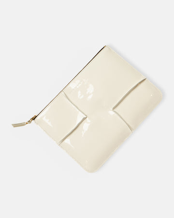 reversed hem patent leather zip top pouch